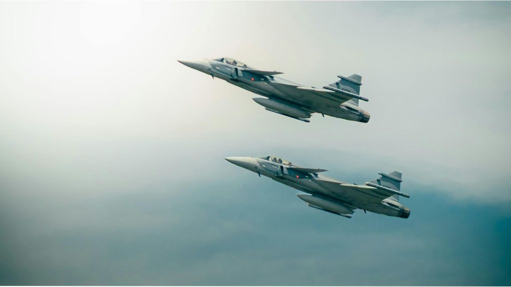 Two fighter jets flying in formation across a cloudy sky, symbolising a provocation from my neighbour.