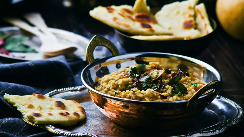 A bowl of Indiamn dhal with Naan bread