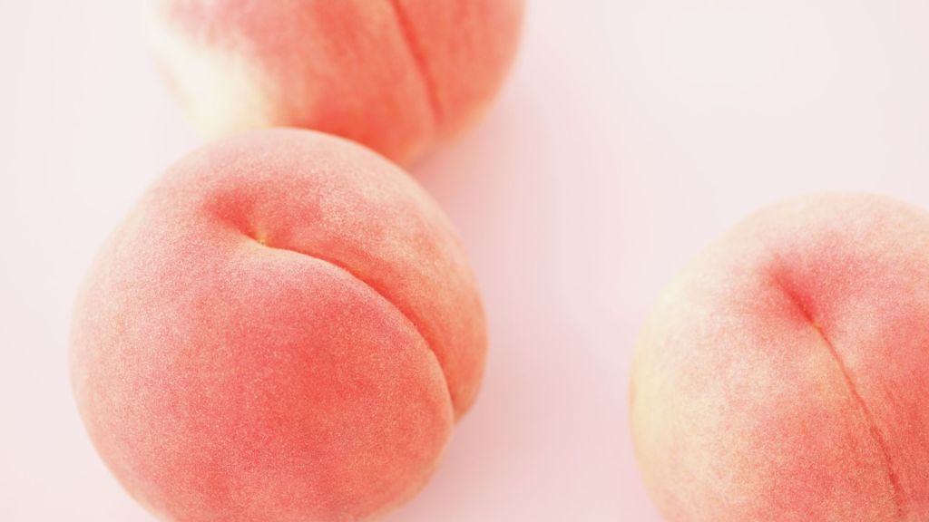 A soft picture of peaches, suggests peach emoji sex